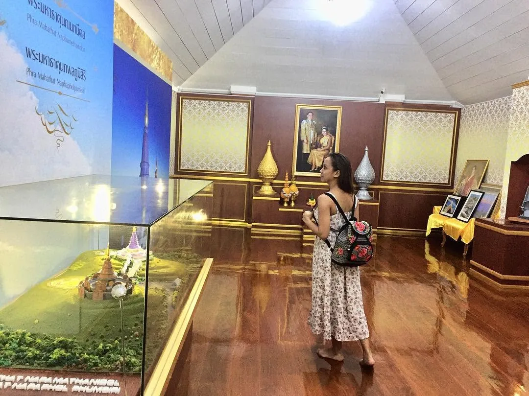 Dee looking at a model of the twin shrines on Doi Inthanon