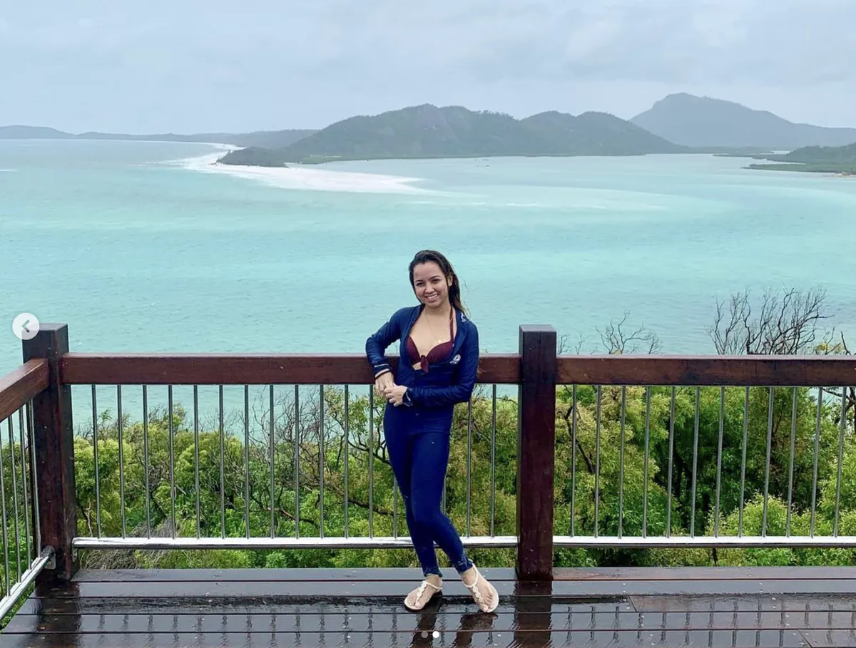 Dee at the Hill Inlet lookout above swirling white sand and turquoise water