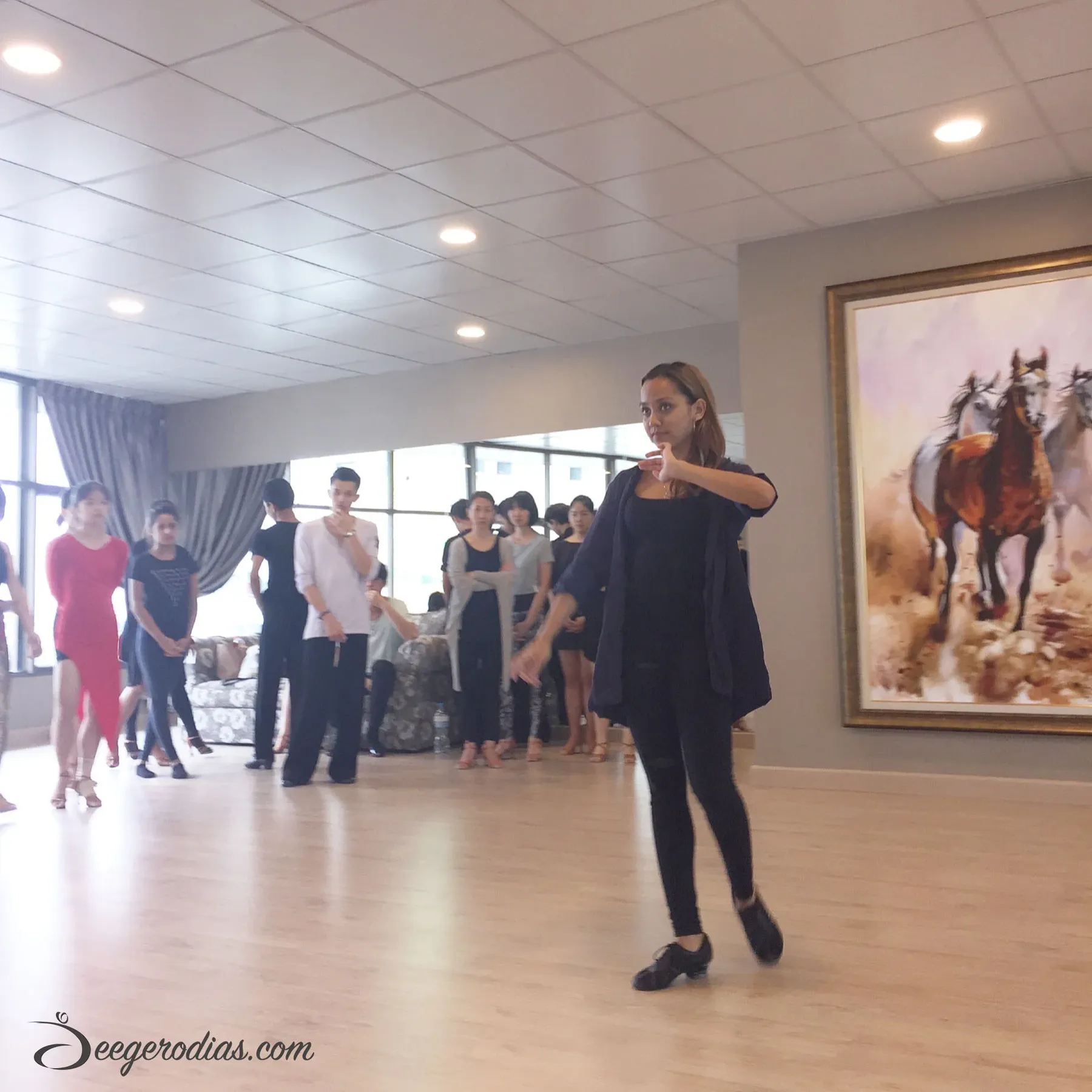 Explaining the reason for the pendulum-rotation action of the hips in the Rumba Walks.