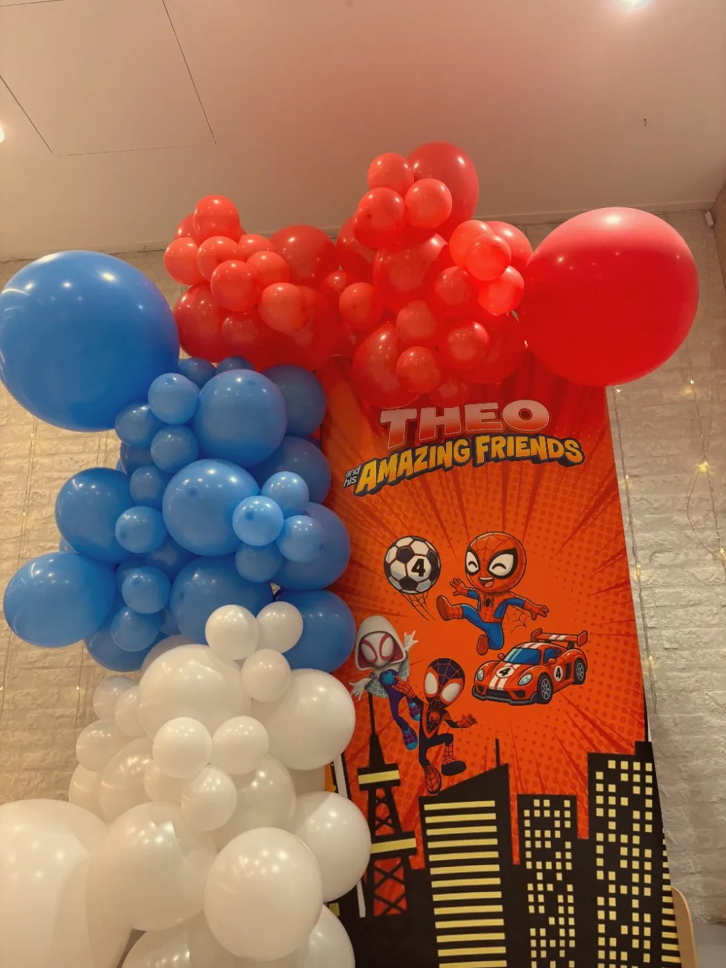 The printed superhero backdrop I designed