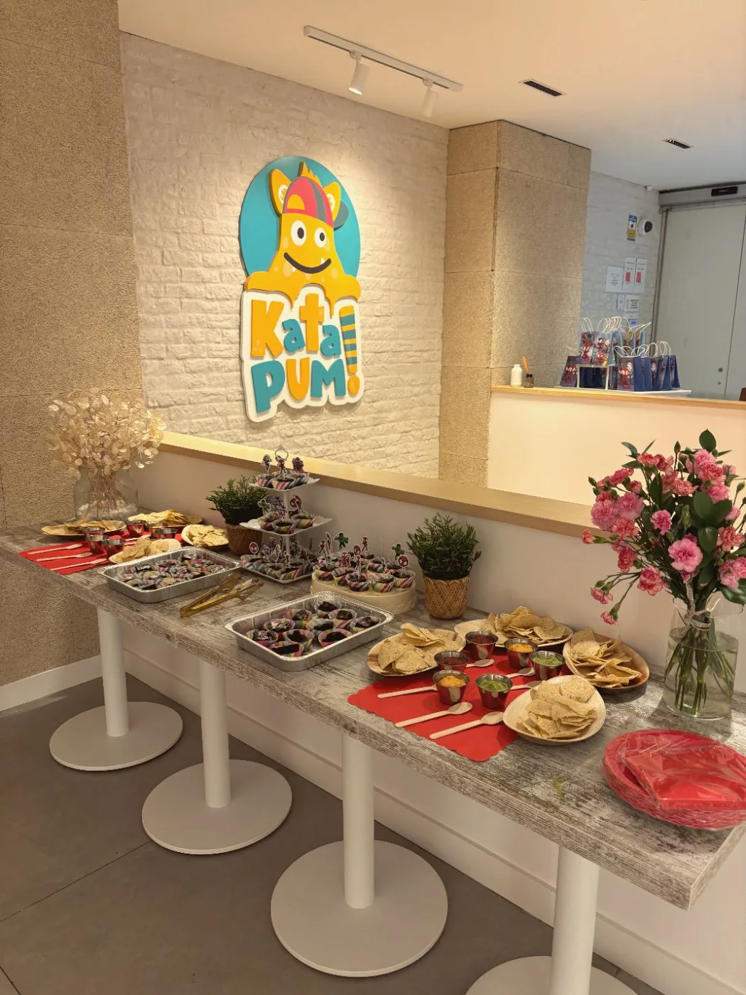 The party table at Katapum, with brownies, nachos and dips