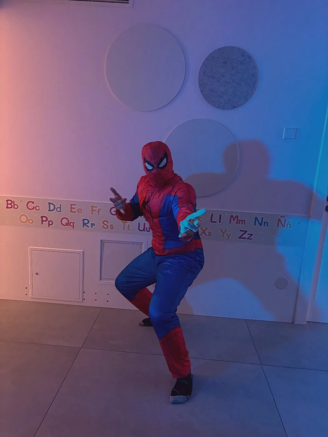 His dad in a Spider-Man suit, mid-pose
